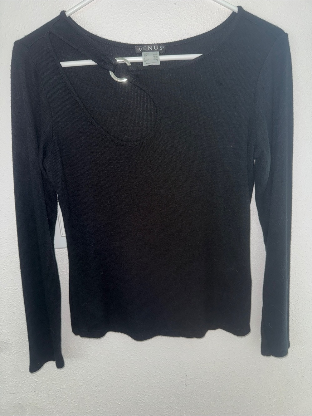 Venus long sleeve black rib knit top with neck ring detail.